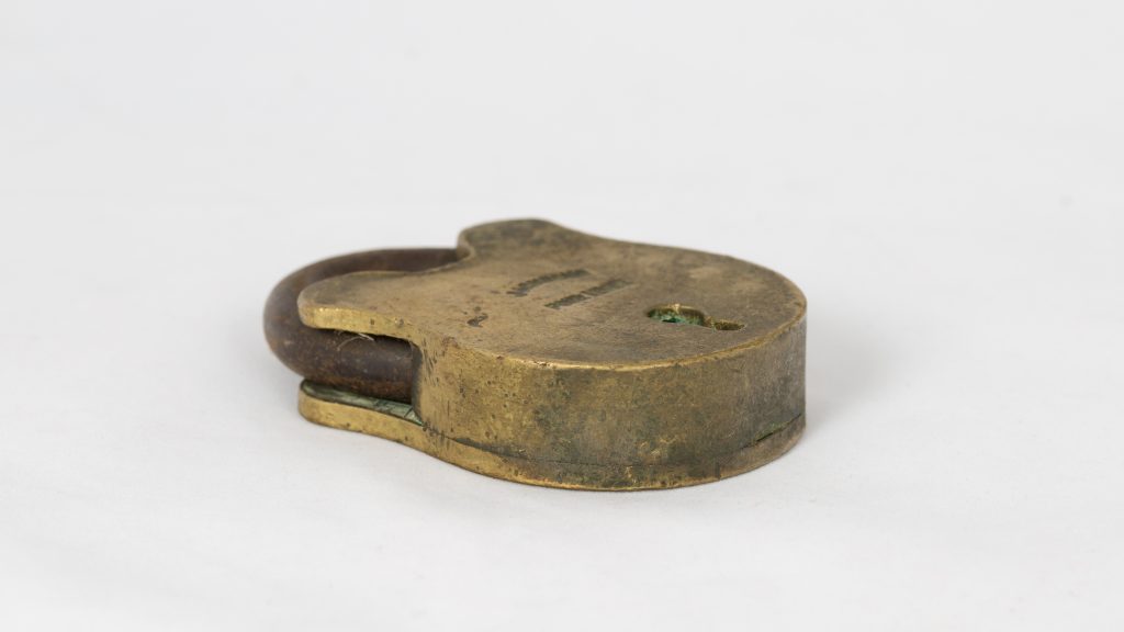 brassy-coloured, metal padlock