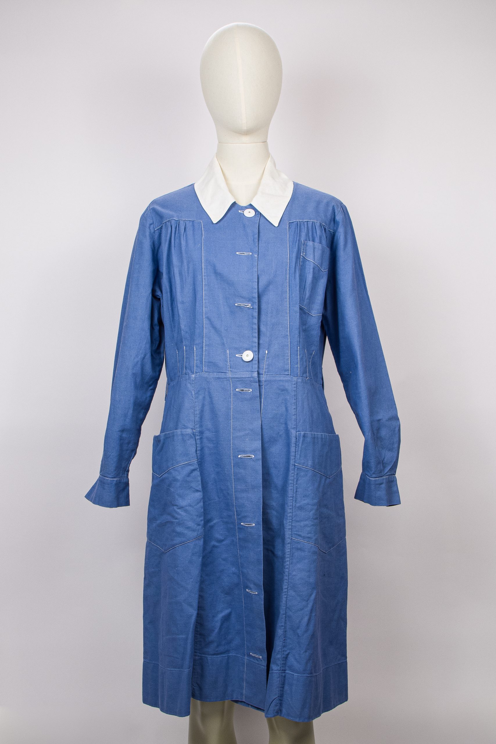 blue vintage nurse's uniform with a white collar