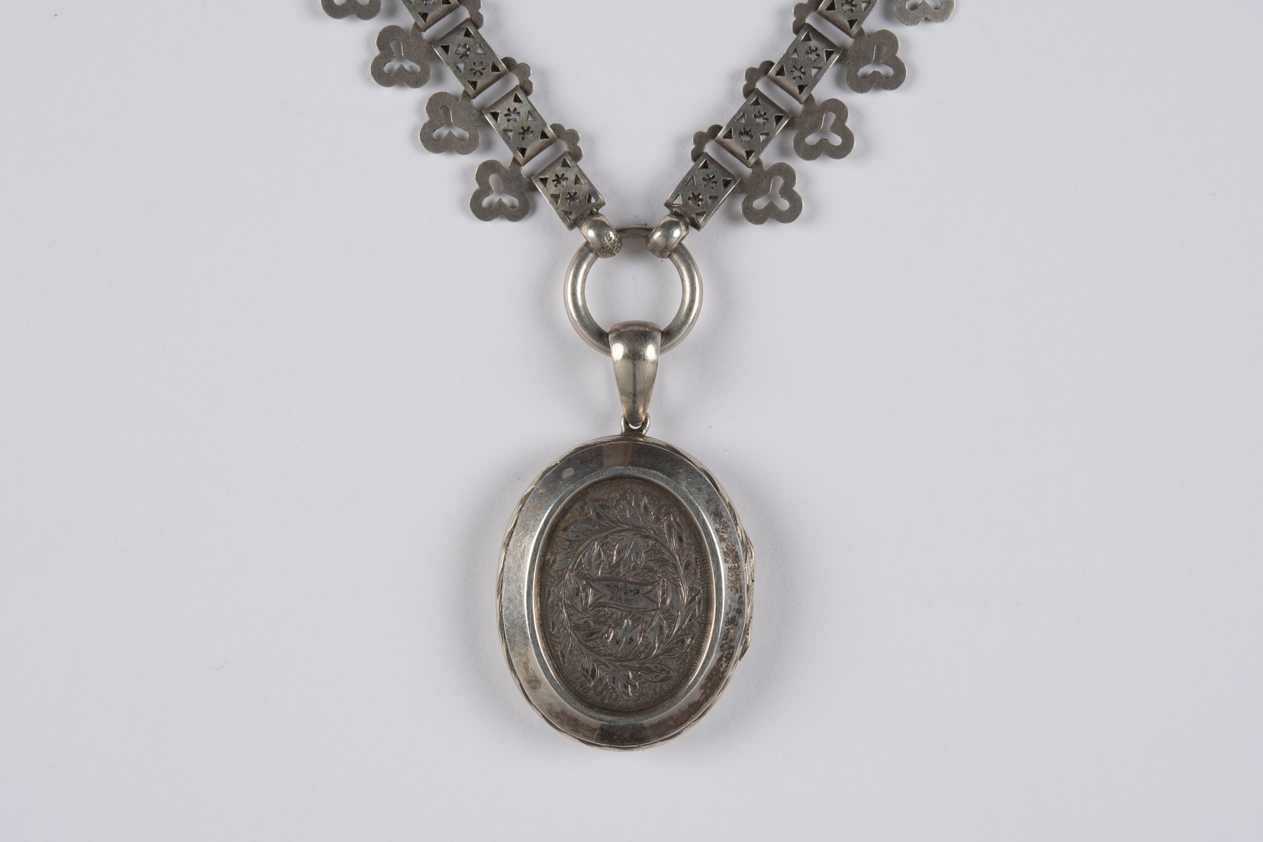 oval locket with floral etched design