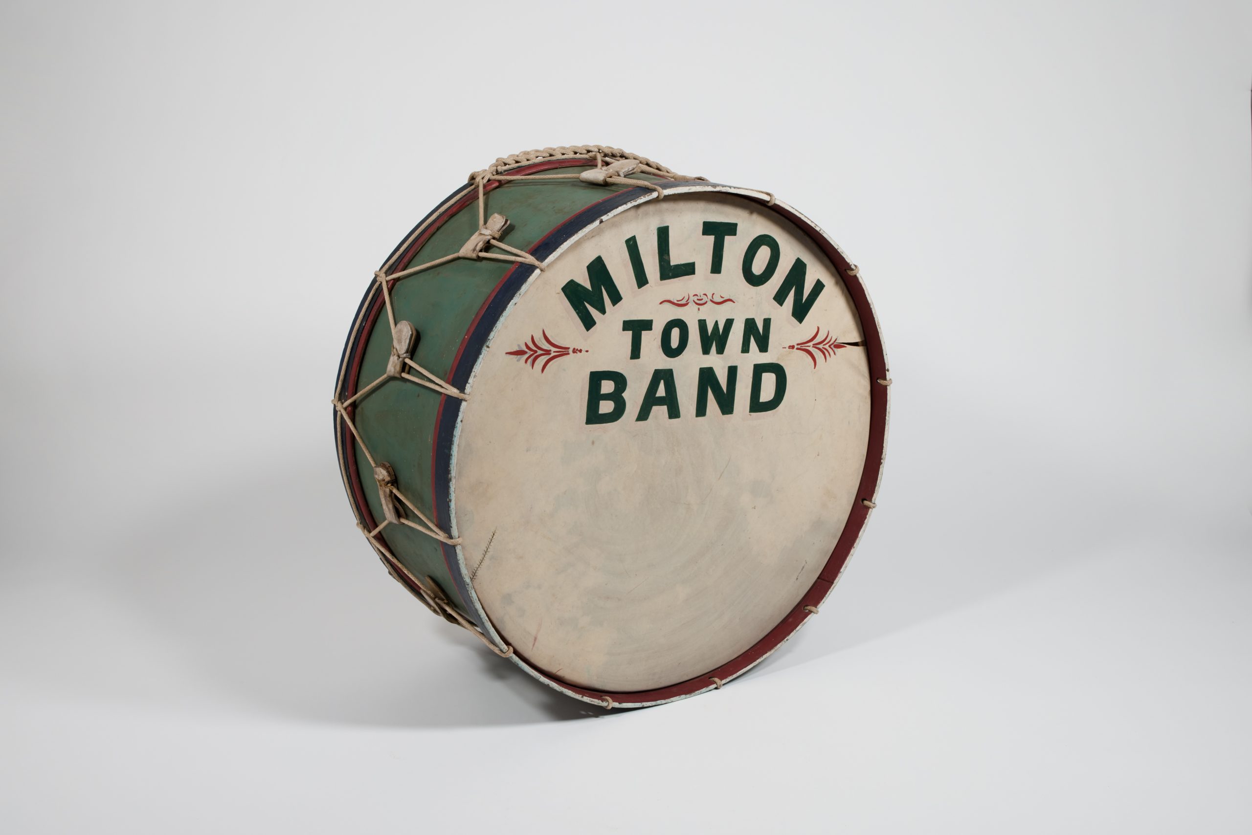 Green bass drum ensribed "MILTON TOWN BAND"