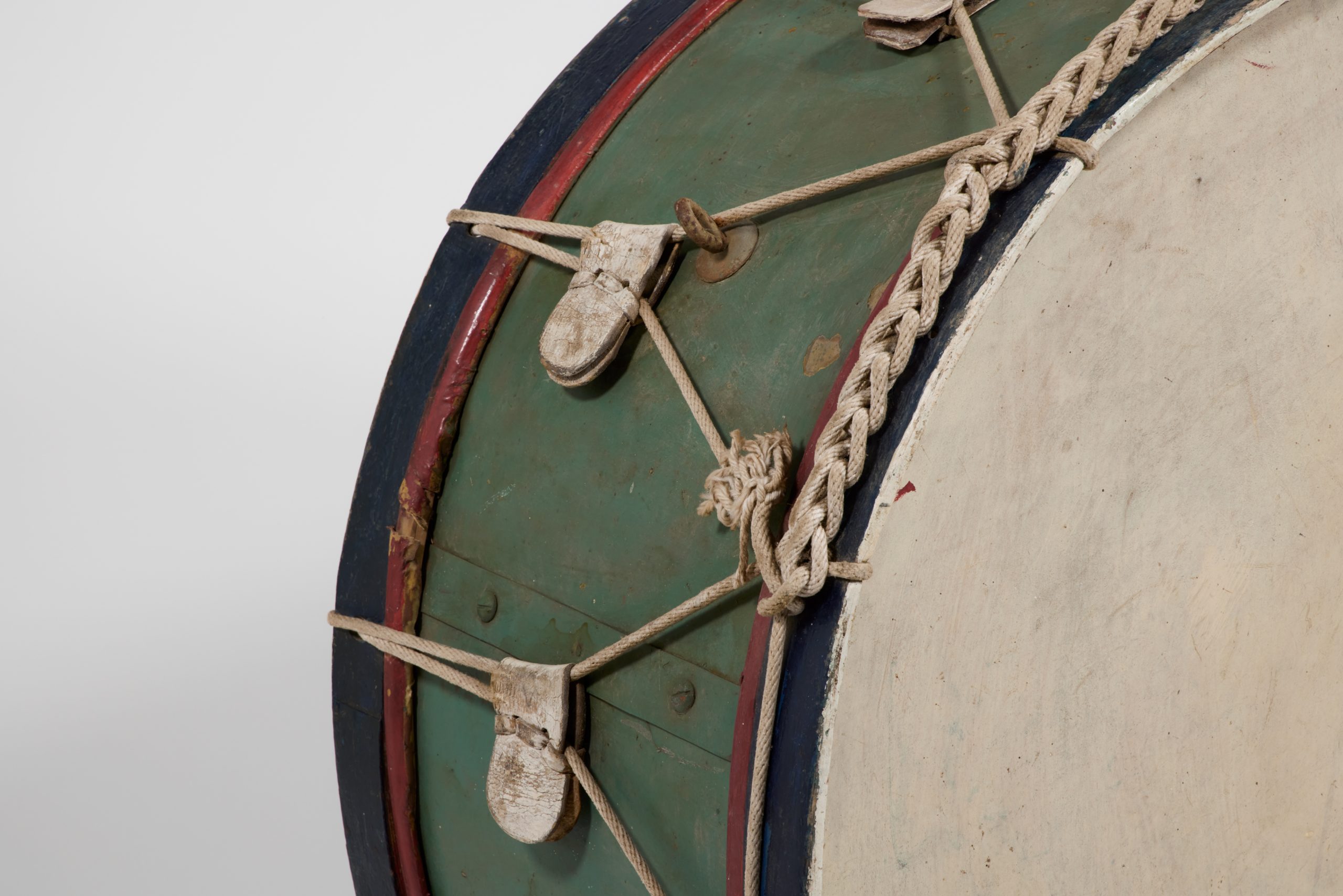Detail shot of corded side of a green bass drum