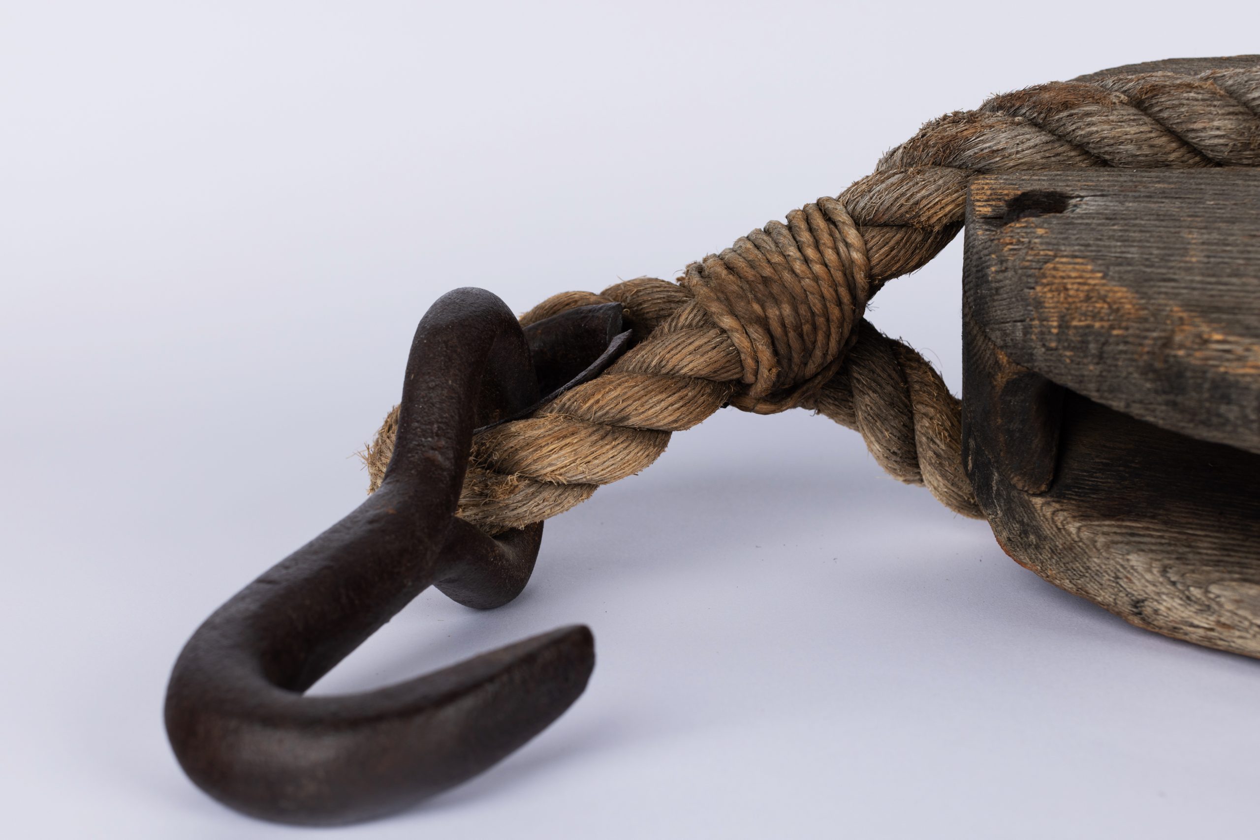 detail of metal hook attached to rope